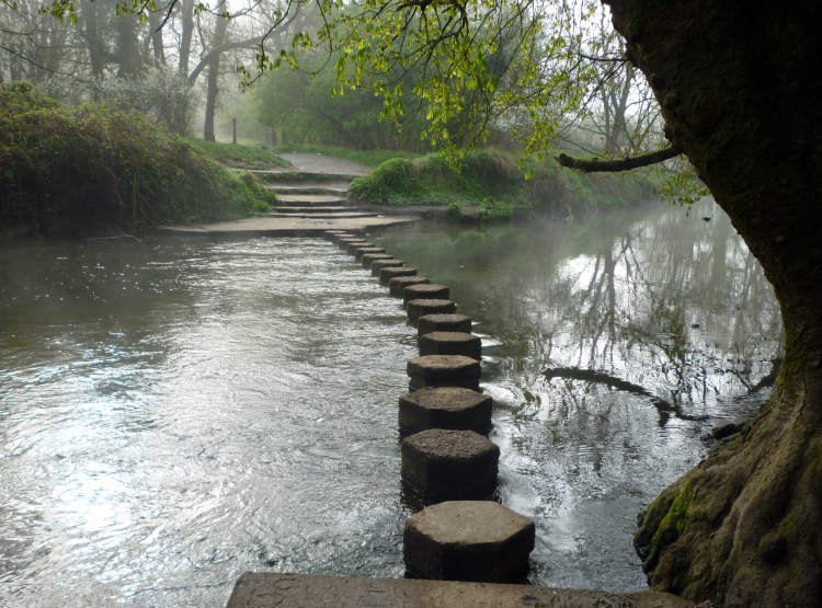Stepping stones on the Rive Mole at Box Hill, with morning mist hanging over the river